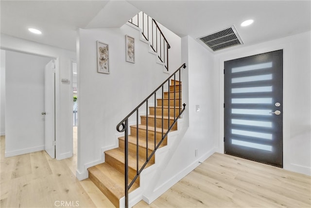 entryway featuring light hardwood / wood-style floors and a healthy amount of sunlight