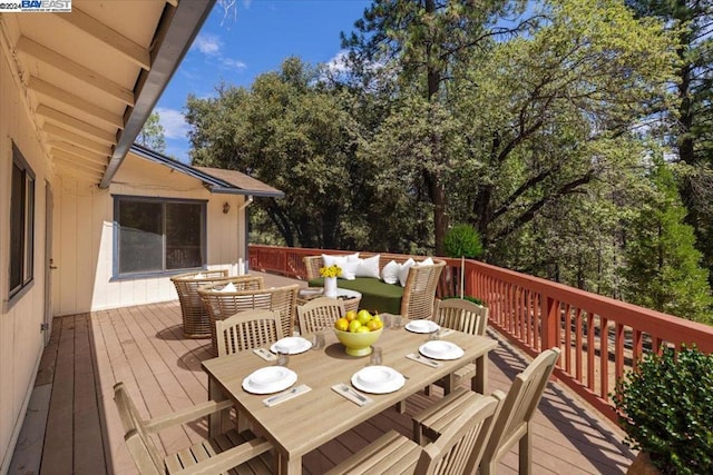 wooden deck with an outdoor hangout area