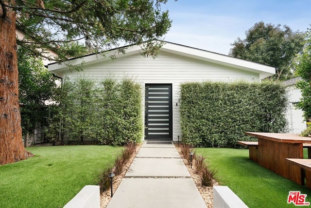 exterior space with a lawn