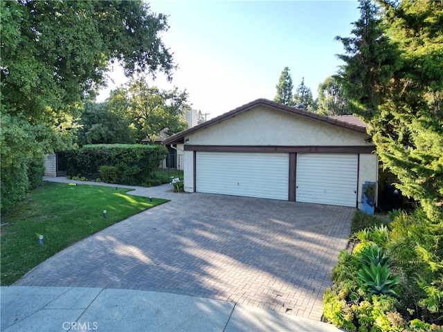 garage with a lawn