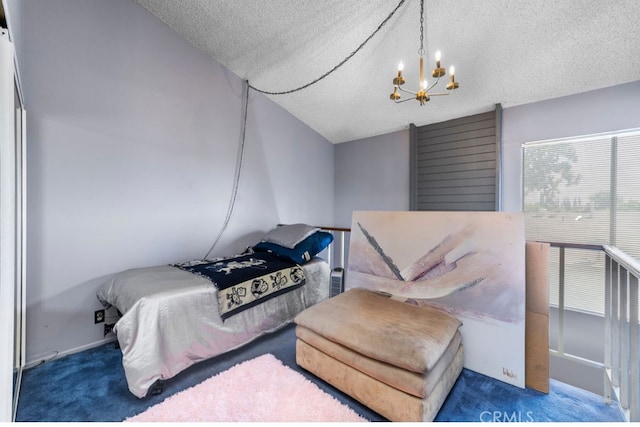 carpeted bedroom with a notable chandelier, lofted ceiling, and a textured ceiling