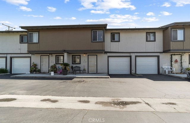 multi unit property featuring a garage