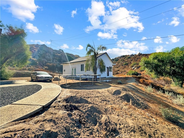 rear view of property with a mountain view