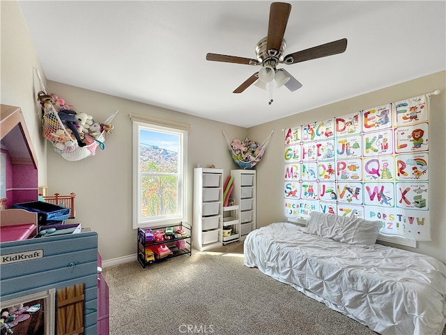 bedroom with ceiling fan and carpet