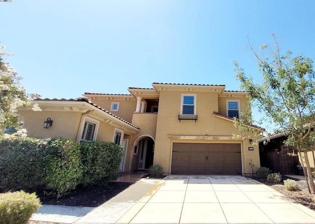 mediterranean / spanish-style home featuring a garage