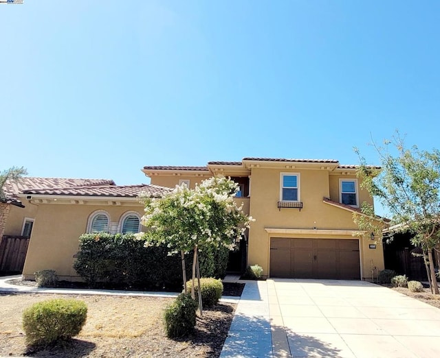 mediterranean / spanish-style house featuring a garage