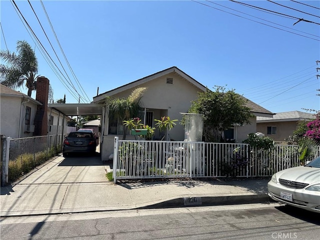 view of front facade with a carport