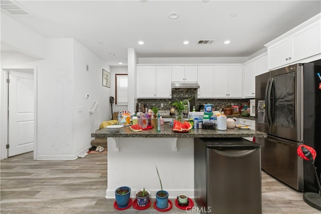 kitchen featuring light hardwood / wood-style floors, stainless steel refrigerator with ice dispenser, a center island with sink, and white cabinets