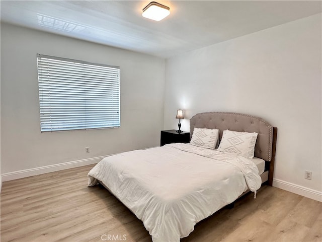 bedroom with light hardwood / wood-style floors