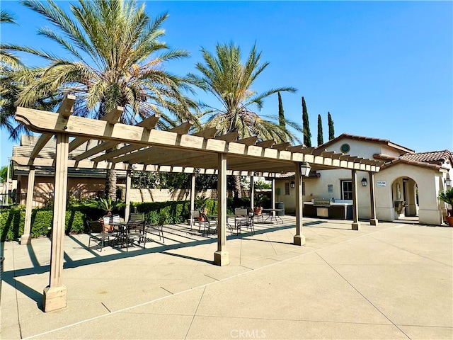 view of property's community with a pergola and a patio