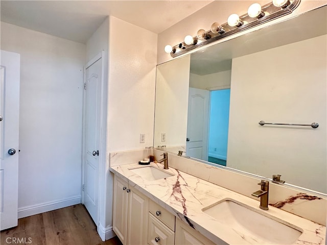 bathroom featuring wood-type flooring and vanity