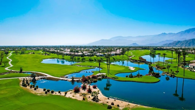 surrounding community with a water and mountain view