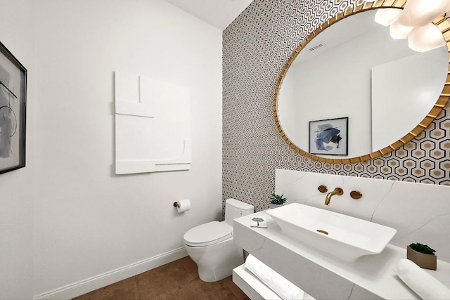 bathroom with tile patterned floors, vanity, and toilet