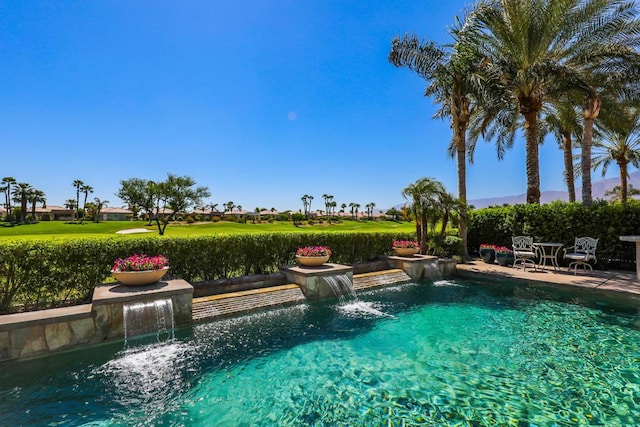 view of pool with pool water feature