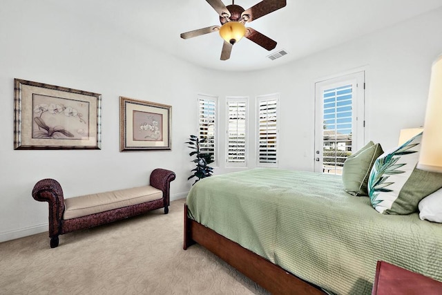 bedroom featuring ceiling fan and light colored carpet