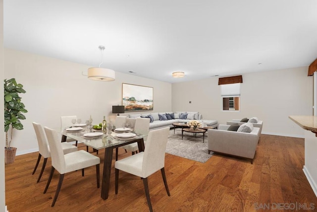 dining area featuring hardwood / wood-style flooring