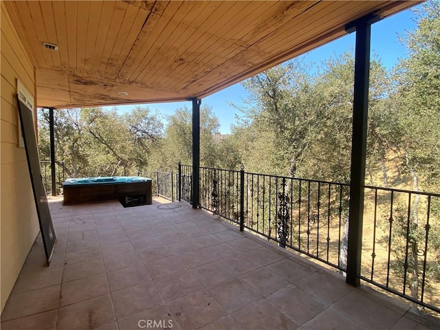 view of patio / terrace with a hot tub