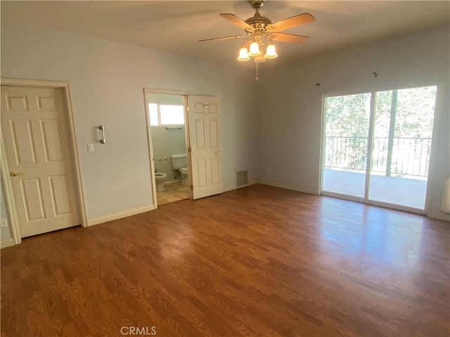 interior space with ceiling fan and wood-type flooring