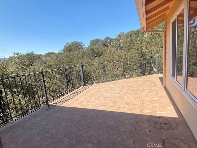 view of patio featuring a balcony