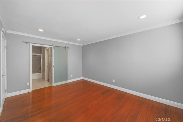 333 Burchett St Unit 308, Glendale, CA 91203 - unfurnished bedroom with recessed lighting, wood finished floors, crown molding, and connected bathroom
