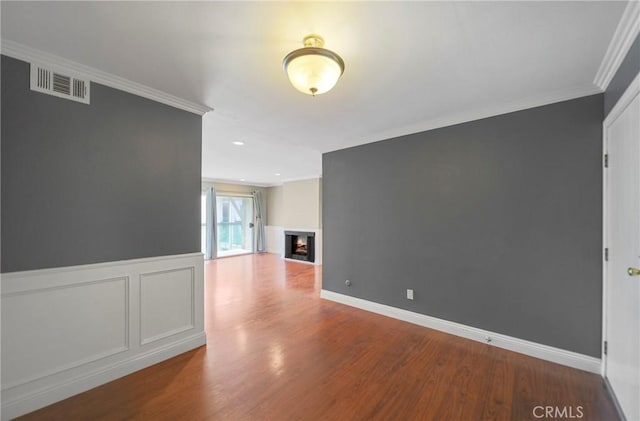333 Burchett St Unit 308, Glendale, CA 91203 - unfurnished room with wood finished floors, crown molding, and a warm lit fireplace