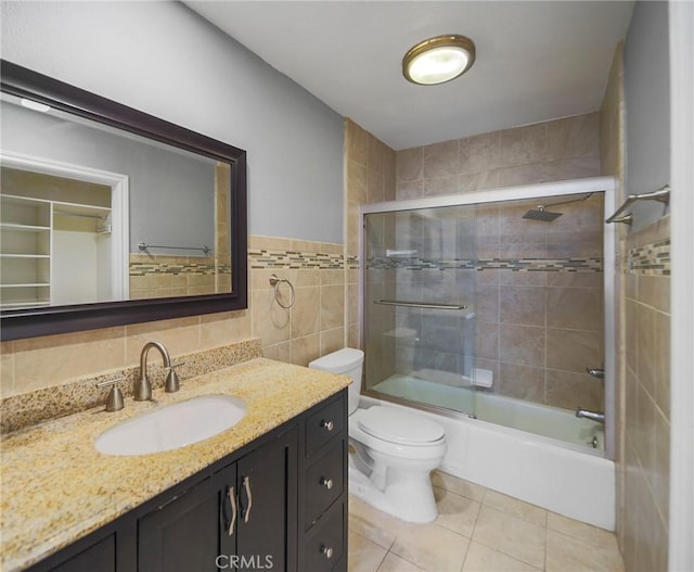 333 Burchett St Unit 308, Glendale, CA 91203 - full bath featuring vanity, tile walls, combined bath / shower with glass door, and tile patterned flooring