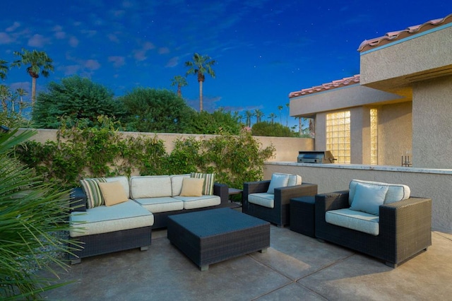 view of patio / terrace with grilling area and an outdoor living space