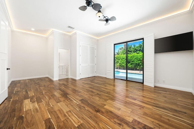 spare room with hardwood / wood-style floors and ornamental molding