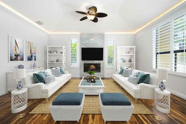 living room featuring plenty of natural light, ceiling fan, and wood-type flooring