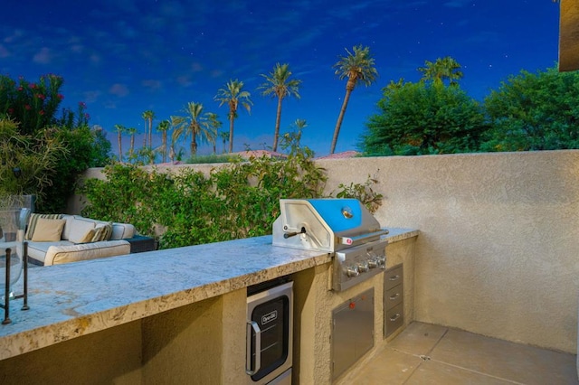 view of patio / terrace featuring area for grilling and exterior kitchen