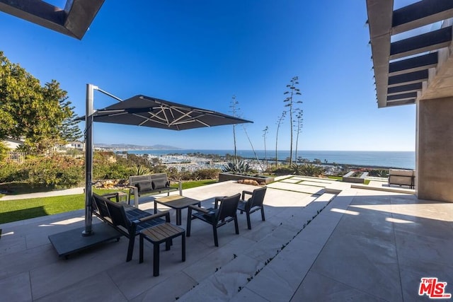 view of patio with a water view