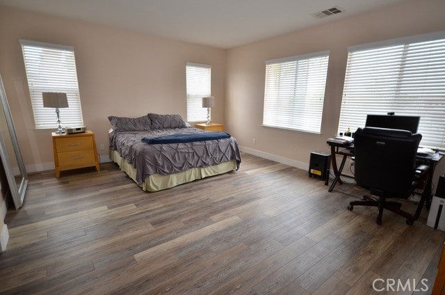 bedroom featuring dark wood-type flooring