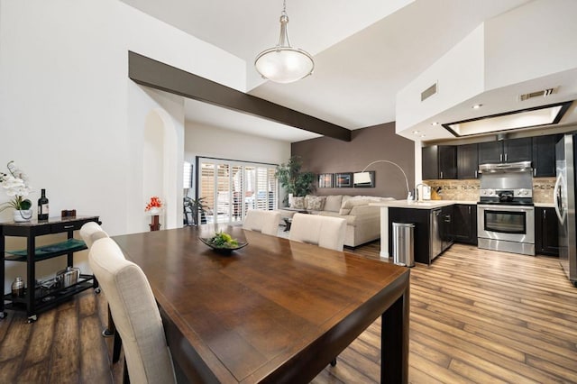 dining space featuring light wood-type flooring