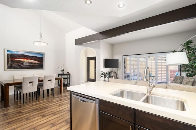 kitchen featuring sink, decorative light fixtures, dishwasher, hardwood / wood-style floors, and lofted ceiling