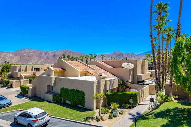 birds eye view of property with a mountain view