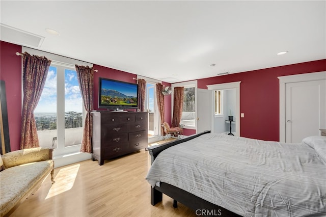 bedroom with light hardwood / wood-style floors