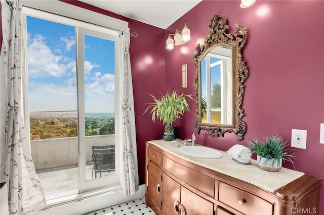 bathroom with a healthy amount of sunlight and vanity