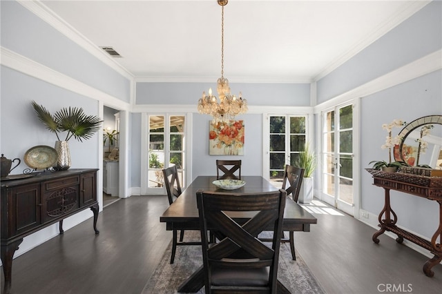 dining area featuring crown molding, dark hardwood / wood-style flooring, and a healthy amount of sunlight