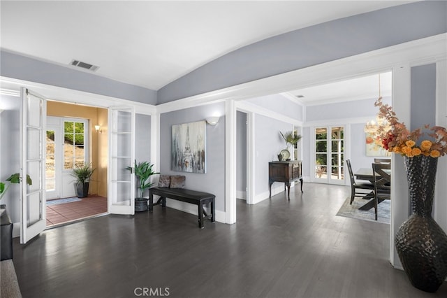 entryway featuring lofted ceiling, dark hardwood / wood-style floors, and french doors