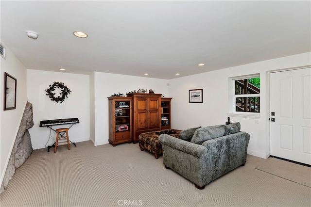 living room featuring light colored carpet