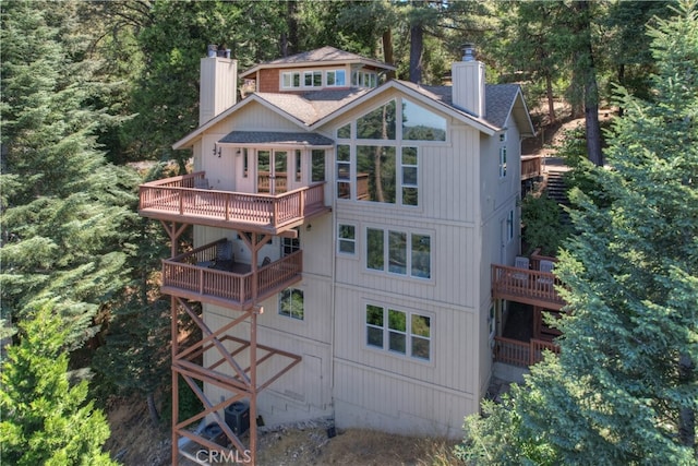 back of house with a balcony