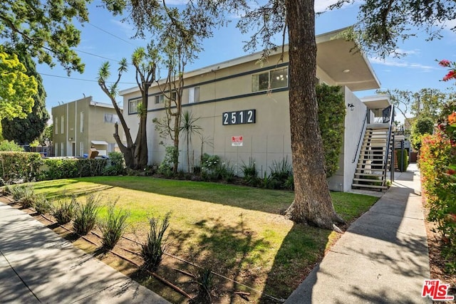 view of home's exterior with a yard