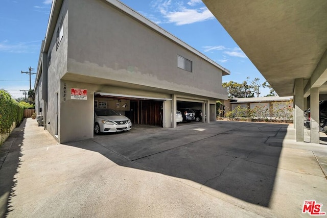 view of side of property with a garage