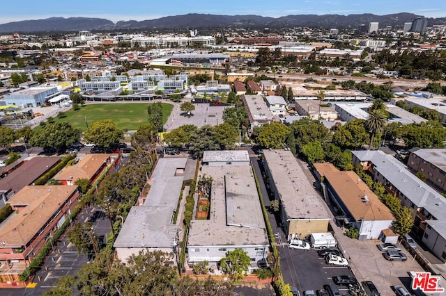 birds eye view of property featuring a mountain view