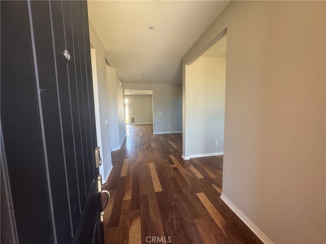 hallway featuring dark hardwood / wood-style floors