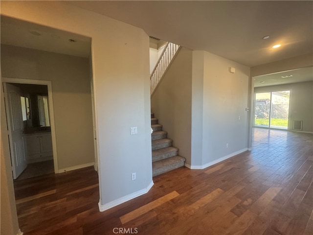 spare room featuring dark hardwood / wood-style flooring