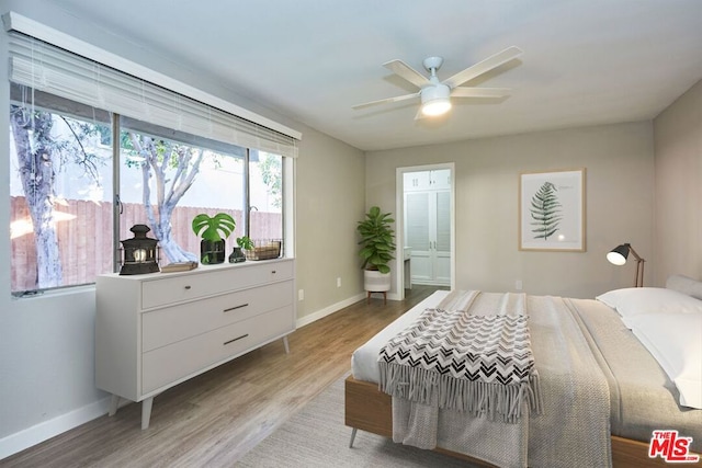 bedroom with ceiling fan and light hardwood / wood-style floors