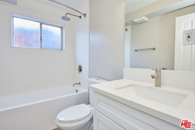 full bathroom with tub / shower combination, vanity, and toilet