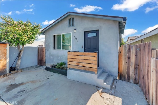 view of front of home with a patio area