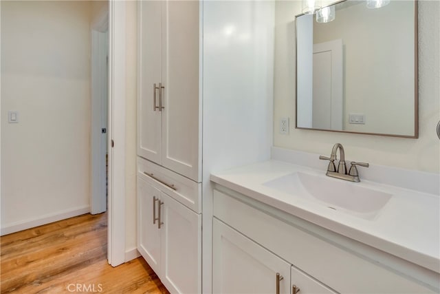 bathroom featuring vanity and hardwood / wood-style flooring